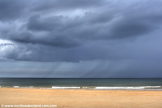 A summer rain shower approaching from the sea.